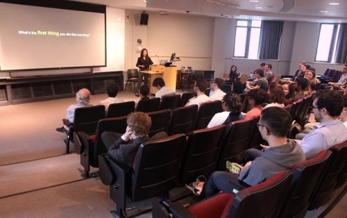 Estella Yu presenting by screen that says, "What's the first thing you did this morning?"