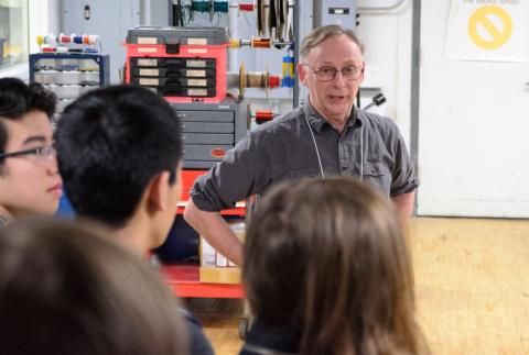 Glenn Northey speaking to students in lab