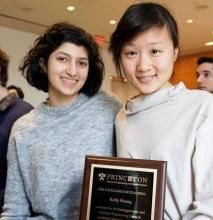 Shalaka Madge smiling with Kelly Huang holding award