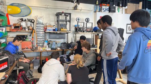 Students work on a boat